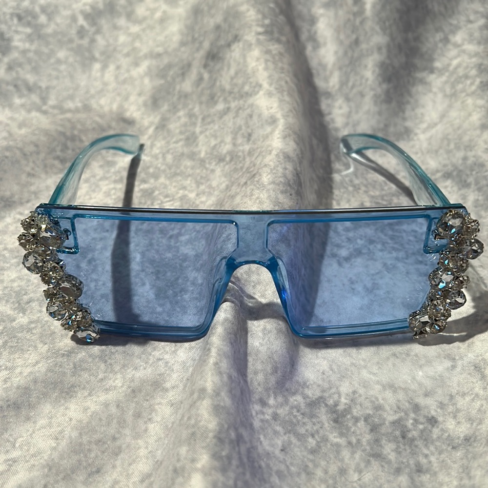 Boxy blue new frameless sunglasses glammed up with rhinestones.